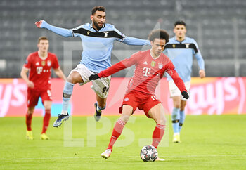 2021-03-17 - Leroy Sane of Bayern Munich and Mohamed Fares of Lazio during the UEFA Champions League, round of 16, 2nd leg football match between Bayern Munich and SS Lazio on March 17, 2021 at Allianz Arena in Munich, Germany - Photo Lennart Preiss / Witters / firo sportphoto / DPPI - BAYERN MUNICH AND SS LAZIO - UEFA CHAMPIONS LEAGUE - SOCCER