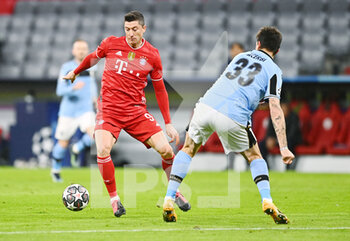 2021-03-17 - Robert Lewandowski of Bayern Munich and Francesco Acerbi of Lazio during the UEFA Champions League, round of 16, 2nd leg football match between Bayern Munich and SS Lazio on March 17, 2021 at Allianz Arena in Munich, Germany - Photo Lennart Preiss / Witters / firo sportphoto / DPPI - BAYERN MUNICH AND SS LAZIO - UEFA CHAMPIONS LEAGUE - SOCCER