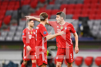 2021-03-17 - Benjamin Pavard of Bayern Munich with Joshua Kimmich during the UEFA Champions League, round of 16, 2nd leg football match between Bayern Munich and SS Lazio on March 17, 2021 at Allianz Arena in Munich, Germany - Photo Lennart Preiss / Witters / firo sportphoto / DPPI - BAYERN MUNICH AND SS LAZIO - UEFA CHAMPIONS LEAGUE - SOCCER