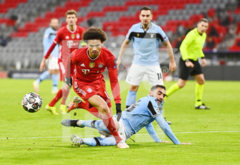 2021-03-17 - Leroy Sane of Bayern Munich and Mohamed Fares of Lazio during the UEFA Champions League, round of 16, 2nd leg football match between Bayern Munich and SS Lazio on March 17, 2021 at Allianz Arena in Munich, Germany - Photo Lennart Preiss / Witters / firo sportphoto / DPPI - BAYERN MUNICH AND SS LAZIO - UEFA CHAMPIONS LEAGUE - SOCCER