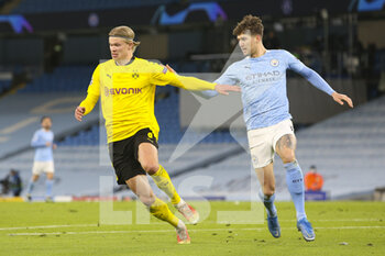 2021-04-06 - Borussia Dortmund forward Erling Haaland (9) and Manchester City defender John Stones (5) during the UEFA Champions League, quarter final, 1st leg football match between Manchester City and Borussia Dortmund on April 6, 2021 at the Etihad Stadium in Manchester, England - Photo Craig Galloway / ProSportsImages / DPPI - MANCHESTER CITY AND BORUSSIA DORTMUND - UEFA CHAMPIONS LEAGUE - SOCCER