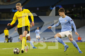 2021-04-06 - Borussia Dortmund forward Erling Haaland (9) and Manchester City defender John Stones (5) during the UEFA Champions League, quarter final, 1st leg football match between Manchester City and Borussia Dortmund on April 6, 2021 at the Etihad Stadium in Manchester, England - Photo Craig Galloway / ProSportsImages / DPPI - MANCHESTER CITY AND BORUSSIA DORTMUND - UEFA CHAMPIONS LEAGUE - SOCCER