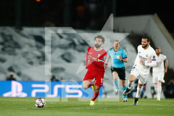 2021-04-06 - Mohamed Salah of Liverpool and Nacho Fernandez of Real Madrid during the UEFA Champions League, Quarter final, 1st leg football match between Real Madrid and Liverpool FC on April 6, 2021 at Alfredo Di Stefano stadium in Valdebebas, Madrid, Spain - Photo Oscar J Barroso / Spain DPPI / DPPI - REAL MADRID AND LIVERPOOL FC - UEFA CHAMPIONS LEAGUE - SOCCER