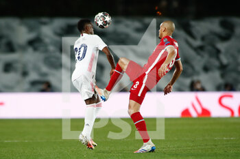 2021-04-06 - Vinicius Junior of Real Madrid and Fabinho of Liverpool during the UEFA Champions League, Quarter final, 1st leg football match between Real Madrid and Liverpool FC on April 6, 2021 at Alfredo Di Stefano stadium in Valdebebas, Madrid, Spain - Photo Oscar J Barroso / Spain DPPI / DPPI - REAL MADRID AND LIVERPOOL FC - UEFA CHAMPIONS LEAGUE - SOCCER