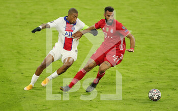 2021-04-07 - Eric Maxim Choupo-Moting of Bayern Munich and Presnel Kimpembe of Paris Saint-Germain during the UEFA Champions League, quarter final, 1st leg football match between Bayern Munich and Paris Saint-Germain on April 7, 2021 at Allianz Arena in Munich, Germany - Photo Marcel Engelbrecht / firo Sportphoto / DPPI - BAYERN MUNICH VS PARIS SAINT-GERMAIN - UEFA CHAMPIONS LEAGUE - SOCCER