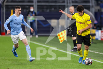 2021-04-14 - Phil Foden of Manchester City and Mateu Morey of Borussia Dortmund during the UEFA Champions League, Quarter-Finals, 2nd leg football match between Borussia Dortmund and Manchester City on April 14, 2021 at Signal Iduna Park in Dortmund, Germany - Photo Joachim Bywaletz / Orange Pictures / DPPI - BORUSSIA DORTMUND VS MANCHESTER CITY - UEFA CHAMPIONS LEAGUE - SOCCER