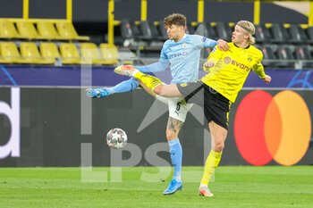 2021-04-14 - John Stones of Manchester City and Erling Haaland of Borussia Dortmund during the UEFA Champions League, Quarter-Finals, 2nd leg football match between Borussia Dortmund and Manchester City on April 14, 2021 at Signal Iduna Park in Dortmund, Germany - Photo Joachim Bywaletz / Orange Pictures / DPPI - BORUSSIA DORTMUND VS MANCHESTER CITY - UEFA CHAMPIONS LEAGUE - SOCCER