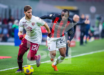 2021-01-12 - Cristian Ansaldi of Torino FC fights for the ball against Pierre Kalulu of AC Milan - AC MILAN VS TORINO FC - ITALIAN CUP - SOCCER