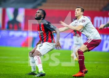 2021-01-12 - Franck Kessie of AC Milan fights for the ball against Alessandro Buongiorno of Torino FC - AC MILAN VS TORINO FC - ITALIAN CUP - SOCCER