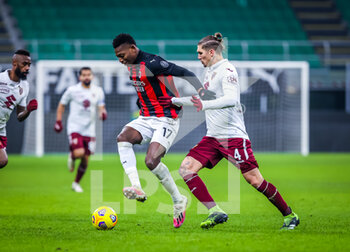 2021-01-12 - Rafael Leao of AC Milan fights for the ball against Lyanco Vojnovic of Torino FC - AC MILAN VS TORINO FC - ITALIAN CUP - SOCCER