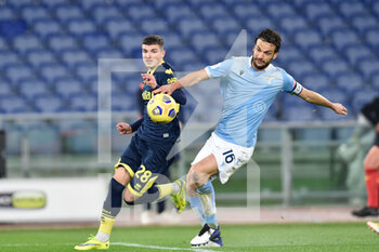 2021-01-21 - ROME, ITALY - January 21 : Marco Parolo (R) of SS Lazio in action against Valentin Mihai Mihaila (L) of Parma during the eighths TIM Cup soccer match between SS Lazio and Parma Stadio Olimpico on January 21,2021 in Rome, Italy  - SS LAZIO VS PARMA CALCIO - ITALIAN CUP - SOCCER