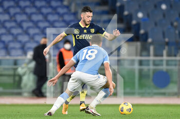 2021-01-21 - ROME, ITALY - January 21 : Mattia Sprocati (L) of Parma in action against Gonzalo Escalante (R) of SS Lazio during the eighths TIM Cup soccer soccer match between SS Lazio and Parma Stadio Olimpico on January 21,2021 in Rome, Italy - SS LAZIO VS PARMA CALCIO - ITALIAN CUP - SOCCER