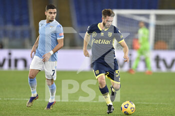 2021-01-21 - ROME, ITALY - January 21 : Giacomo Ricci (R) of Parma in action against Andreas Pereira (L) of SS Lazio during the eighths TIM Cup soccer soccer match between SS Lazio and Parma Stadio Olimpico on January 21,2021 in Rome, Italy - SS LAZIO VS PARMA CALCIO - ITALIAN CUP - SOCCER