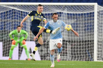 2021-01-21 - ROME, ITALY - January 21 : Jasmin Kurtic (L) of Parma in action against Vedat Muriqi (R) of SS Lazio during the eighths TIM Cup soccer soccer match between SS Lazio and Parma Stadio Olimpico on January 21,2021 in Rome, Italy  - SS LAZIO VS PARMA CALCIO - ITALIAN CUP - SOCCER