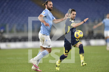 2021-01-21 - ROME, ITALY - January 21 : Jacopo Dezi (R) of Parma in action against Vedat Muriqi (L) of SS Lazio during the eighths TIM Cup soccer soccer match between SS Lazio and Parma Stadio Olimpico on January 21,2021 in Rome, Italy  - SS LAZIO VS PARMA CALCIO - ITALIAN CUP - SOCCER