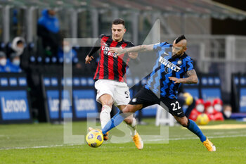 2021-01-26 - Diogo Dalot (AC Milan) and Arturo Vidal (FC Internazionale) - FC INTERNAZIONALE VS AC MILAN - ITALIAN CUP - SOCCER