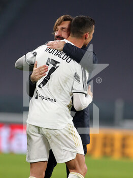 2021-02-09 - Andrea Pirlo (Coach Juventus FC) celebrates with Cristiano Ronaldo (Juventus FC) - JUVENTUS FC VS FC INTERNAZIONALE - ITALIAN CUP - SOCCER