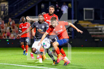 2020-09-22 - Luton Town defender Tom Lockyer (15) clears the ball from Manchester United forward Odion Ighalo (25) during the English League Cup, EFL Carabao Cup, football match between Luton Town and Manchester United on September 22, 2020 at Kenilworth Road in Luton, England - Photo Nigel Keene / ProSportsImages / DPPI - LUTON TOWN VS MANCHESTER UNITED - ENGLISH LEAGUE CUP - SOCCER