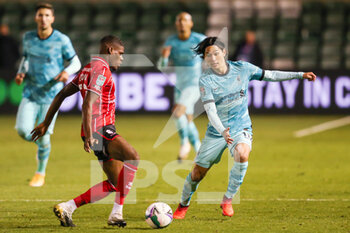 2020-09-24 - Lincoln City defender Timothy Eyoma (22) and Liverpool forward Takumi Minamino (18) during the English League Cup, EFL Carabao Cup, football match between Lincoln City and Liverpool on September 24, 2020 at Sincil Bank in Lincoln, England - Photo Shaun Conway / ProSportsImages / DPPI - LINCOLN CITY VS LIVERPOOL - ENGLISH LEAGUE CUP - SOCCER