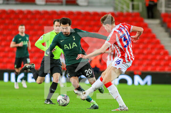 2020-12-23 - Tottenham Hotspur midfielder Dele Alli (20) takes on Stoke City defender Harry Souttar (36) during the English League Cup, EFL Cup quarter-final football match between Stoke City and Tottenham Hotspur on December 23, 2020 at the Bet365 Stadium in Stoke-on-Trent, England - Photo kevin Warburton - A Moment in Sport / ProSportsImages / DPPI - STOKE CITY VS TOTTENHAM HOTSPUR - ENGLISH LEAGUE CUP - SOCCER