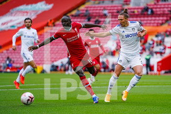 2020-09-12 - Leeds United defender Luke Ayling (2) tackles Liverpool forward Sadio Mane (10) during the English championship Premier League football match between Liverpool and Leeds United on September 12, 2020 at Anfield in Liverpool, England - Photo Malcolm Bryce / ProSportsImages / DPPI - LIVERPOOL VS LEEDS UNITED - ENGLISH PREMIER LEAGUE - SOCCER