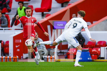 2020-09-12 - Leeds United forward Patrick Bamford (9) and Liverpool midfielder Jordan Henderson (14) during the English championship Premier League football match between Liverpool and Leeds United on September 12, 2020 at Anfield in Liverpool, England - Photo Malcolm Bryce / ProSportsImages / DPPI - LIVERPOOL VS LEEDS UNITED - ENGLISH PREMIER LEAGUE - SOCCER
