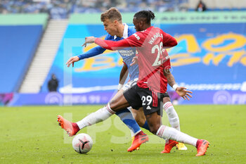 2020-09-26 - Manchester United defender Aaron Wan-Bissaka tackles Brighton and Hove Albion midfielder Solly March (20) during the English championship Premier League football match between Brighton and Hove Albion and Manchester United on September 26, 2020 at the American Express Community Stadium in Brighton and Hove, England - Photo Phil Duncan / ProSportsImages / DPPI - BRIGHTON AND HOVE ALBION - ENGLISH PREMIER LEAGUE - SOCCER