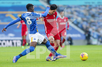 2020-11-28 - Liverpool forward Takumi Minamino battles with Brighton and Hove Albion midfielder Yves Bissouma (8) during the English championship, Premier League football match between Brighton and Hove Albion and Liverpool on November 28, 2020 at the American Express Community Stadium in Brighton and Hove, England - Photo Phil Duncan / ProSportsImages / DPPI - BRIGHTON AND HOVE ALBION VS LIVERPOOL - ENGLISH PREMIER LEAGUE - SOCCER