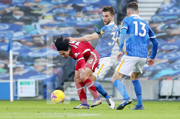 2020-11-28 - Liverpool forward Takumi Minamino battles with Brighton and Hove Albion defender Joel Veltman (34) during the English championship, Premier League football match between Brighton and Hove Albion and Liverpool on November 28, 2020 at the American Express Community Stadium in Brighton and Hove, England - Photo Phil Duncan / ProSportsImages / DPPI - BRIGHTON AND HOVE ALBION VS LIVERPOOL - ENGLISH PREMIER LEAGUE - SOCCER
