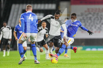 2020-12-16 - Fulham midfielder Andre-Frank Zambo Anguissa (29) tackled by Brighton and Hove Albion midfielder Yves Bissouma (8) during the English championship Premier League football match between Fulham and Brighton and Hove Albion on December 16, 2020 at Craven Cottage in London, England - Photo Phil Duncan / ProSportsImages / DPPI - FULHAM AND BRIGHTON VS HOVE ALBION - ENGLISH PREMIER LEAGUE - SOCCER