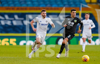 2020-12-27 - Leeds United defender Stuart Dallas (15), Matthew Lowton of Burnley during the English championship Premier League football match between Leeds United and Burnley on December 27, 2020 at Elland Road in Leeds, England - Photo Simon Davies / ProSportsImages / DPPI - LEEDS UNITED VS BURNLEY - ENGLISH PREMIER LEAGUE - SOCCER