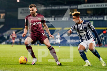 2020-12-29 - Leeds United defender Stuart Dallas (15) and Callum Robinson of WBA during the English championship Premier League football match between West Bromwich Albion and Leeds United on December 29, 2020 at The Hawthorns, West Bromwich, England - Photo Malcolm Bryce / ProSportsImages / DPPI - WEST BROMWICH ALBION VS LEEDS UNITED - ENGLISH PREMIER LEAGUE - SOCCER