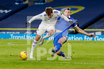 2021-01-16 - Brighton and Hove Albion defender Adam Webster (4) tackles Leeds United forward Patrick Bamford (9) during the English championship Premier League football match between Leeds United and Brighton and Hove Albion on January 16, 2021 at Elland Road in Leeds, England - Photo Simon Davies / ProSportsImages / DPPI - LEEDS UNITED AND BRIGHTON AND HOVE ALBION - ENGLISH PREMIER LEAGUE - SOCCER