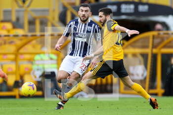 2021-01-16 - Robert Snodgrass (23) of West Bromwich Albion battles with Joao Moutinho (28) of Wolverhampton Wanderers during the English championship Premier League football match between Wolverhampton Wanderers and West Bromwich Albion on January 16, 2021 at Molineux stadium in Wolverhampton, England - Photo Nigel Keene / ProSportsImages / DPPI - WOLVERHAMPTON WANDERERS VS WEST BROMWICH ALBION - ENGLISH PREMIER LEAGUE - SOCCER