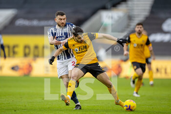 2021-01-16 - Robert Snodgrass (23) of West Bromwich Albion tussles with Pedro Neto (7) of Wolverhampton Wanderers during the English championship Premier League football match between Wolverhampton Wanderers and West Bromwich Albion on January 16, 2021 at Molineux stadium in Wolverhampton, England - Photo Nigel Keene / ProSportsImages / DPPI - WOLVERHAMPTON WANDERERS VS WEST BROMWICH ALBION - ENGLISH PREMIER LEAGUE - SOCCER