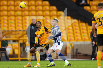 2021-01-16 - Nelson Semedo (22) of Wolverhampton Wanderers tussles with Callum Robinson (7) of West Bromwich Albion during the English championship Premier League football match between Wolverhampton Wanderers and West Bromwich Albion on January 16, 2021 at Molineux stadium in Wolverhampton, England - Photo Nigel Keene / ProSportsImages / DPPI - WOLVERHAMPTON WANDERERS VS WEST BROMWICH ALBION - ENGLISH PREMIER LEAGUE - SOCCER