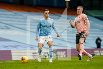 2021-01-30 - Manchester City midfielder Phil Foden (47) and John Lundstram of Sheffield during the English championship Premier League football match between Manchester City and Sheffield United on January 30, 2021 at the Etihad Stadium in Manchester, England - Photo Malcolm Bryce / ProSportsImages / DPPI - MANCHESTER CITY AND SHEFFIELD UNITED - ENGLISH PREMIER LEAGUE - SOCCER
