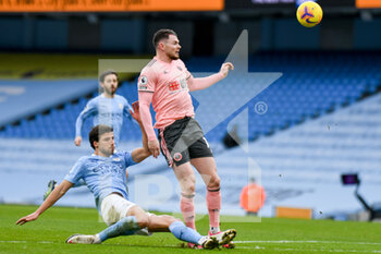 2021-01-30 - Manchester City defender Ruben Dias (3) tackles Sheffield United midfielder Oliver Burke (14) during the English championship Premier League football match between Manchester City and Sheffield United on January 30, 2021 at the Etihad Stadium in Manchester, England - Photo Malcolm Bryce / ProSportsImages / DPPI - MANCHESTER CITY AND SHEFFIELD UNITED - ENGLISH PREMIER LEAGUE - SOCCER
