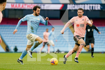 2021-01-30 - Manchester City midfielder Bernardo Silva (20) and Sheffield United midfielder Oliver Norwood (16) during the English championship Premier League football match between Manchester City and Sheffield United on January 30, 2021 at the Etihad Stadium in Manchester, England - Photo Malcolm Bryce / ProSportsImages / DPPI - MANCHESTER CITY AND SHEFFIELD UNITED - ENGLISH PREMIER LEAGUE - SOCCER