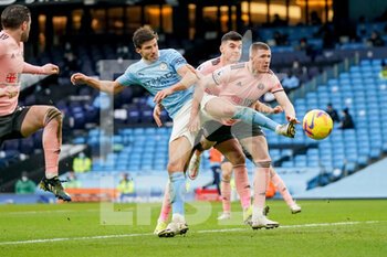 2021-01-30 - Manchester City defender Ruben Dias (3) and John Lundstram of Sheffield during the English championship Premier League football match between Manchester City and Sheffield United on January 30, 2021 at the Etihad Stadium in Manchester, England - Photo Malcolm Bryce / ProSportsImages / DPPI - MANCHESTER CITY AND SHEFFIELD UNITED - ENGLISH PREMIER LEAGUE - SOCCER
