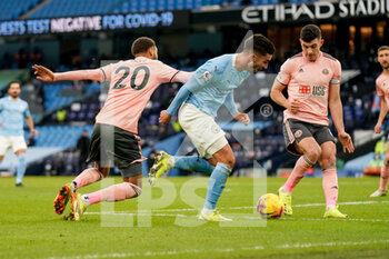 2021-01-30 - Sheffield United defender Jayden Bogle (20) tackles Manchester City midfielder Ferran Torres (21) during the English championship Premier League football match between Manchester City and Sheffield United on January 30, 2021 at the Etihad Stadium in Manchester, England - Photo Malcolm Bryce / ProSportsImages / DPPI - MANCHESTER CITY AND SHEFFIELD UNITED - ENGLISH PREMIER LEAGUE - SOCCER
