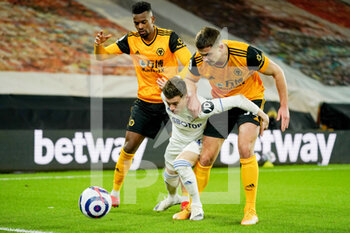 2021-02-19 - Leeds United defender Gjanni Alioski (10) wrestles with two Wolverhampton Wanderers defenders during the English championship Premier League football match between Wolverhampton Wanderers and Leeds United on February 19, 2021 at Molineux stadium in Wolverhampton, England - Photo Malcolm Bryce / ProSportsImages / DPPI - WOLVERHAMPTON WANDERERS AND LEEDS UNITED - ITALIAN SERIE A - SOCCER