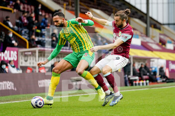 2021-02-20 - Burnley forward Jay Rodriguez (19) tackles West Bromwich Albion defender Kyle Bartley (5) during the English championship Premier League football match between Burnley and West Bromwich Albion on February 20, 2021 at Turf Moor in Burnley, England - Photo Malcolm Bryce / ProSportsImages / DPPI - BURNLEY AND WEST BROMWICH ALBION - ENGLISH PREMIER LEAGUE - SOCCER