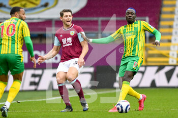 2021-02-20 - Burnley defender James Tarkowski (5) and West Bromwich Albion forward Mbaye Diagne (17) during the English championship Premier League football match between Burnley and West Bromwich Albion on February 20, 2021 at Turf Moor in Burnley, England - Photo Malcolm Bryce / ProSportsImages / DPPI - BURNLEY AND WEST BROMWICH ALBION - ENGLISH PREMIER LEAGUE - SOCCER
