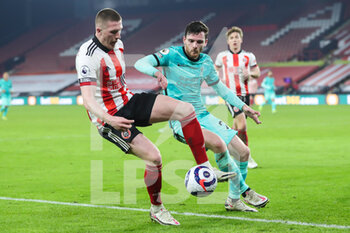 2021-02-28 - Sheffield United midfielder John Lundstram (7) and Liverpool defender Andy Robertson (26) during the English championship Premier League football match between Sheffield United and Liverpool on February 28, 2021 at Bramall Lane in Sheffield, England - Photo Shaun Conway / ProSportsImages / DPPI - SHEFFIELD UNITED AND LIVERPOOL - ENGLISH PREMIER LEAGUE - SOCCER