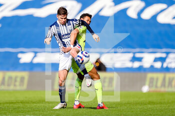 2021-03-07 - West Bromwich Albion defender Conor Townsend (14) and Newcastle United forward Joelinton (9) tussle for the ball during the English championship Premier League football match between West Bromwich Albion and Newcastle United on March 7, 2021 at The Hawthorns in West Bromwich, England - Photo Kevin Warburton / A Moment in Sport / ProSportsImages / DPPI - WEST BROMWICH ALBION AND NEWCASTLE UNITED - ENGLISH PREMIER LEAGUE - SOCCER