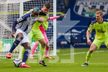 2021-03-07 - West Bromwich Albion forward Mbaye Diagne and Ciaran Clark of Newcastle during the English championship Premier League football match between West Bromwich Albion and Newcastle United on March 7, 2021 at The Hawthorns in West Bromwich, England - Photo Kevin Warburton / A Moment in Sport / ProSportsImages / DPPI - WEST BROMWICH ALBION AND NEWCASTLE UNITED - ENGLISH PREMIER LEAGUE - SOCCER