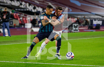 2021-03-08 - Leeds United forward Raphinha (18) challenged by West Ham United defender Aaron Cresswell (3) during the English championship Premier League football match between West Ham United and Leeds United on March 8, 2021 at the London Stadium in London, England - Photo Simon Davies / ProSportsImages / DPPI - WEST HAM UNITED AND LEEDS UNITED - ENGLISH PREMIER LEAGUE - SOCCER
