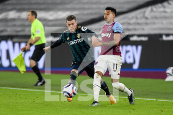 2021-03-08 - Leeds United defender Gjanni Alioski (10) tackles West Ham United midfielder Jesse Lingard (11) during the English championship Premier League football match between West Ham United and Leeds United on March 8, 2021 at the London Stadium in London, England - Photo Malcolm Bryce / ProSportsImages / DPPI - WEST HAM UNITED AND LEEDS UNITED - ENGLISH PREMIER LEAGUE - SOCCER