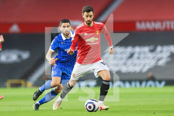 2021-04-04 - Manchester United Midfielder Bruno Fernandes battles with Brighton and Hove Albion forward Neal Maupay (9) during the English championship Premier League football match between Manchester United and Brighton and Hove Albion on April 4, 2021 at Old Trafford in Manchester, England - Photo Phil Duncan / ProSportsImages / DPPI - MANCHESTER UNITED VS BRIGHTON AND HOVE ALBION - ENGLISH PREMIER LEAGUE - SOCCER
